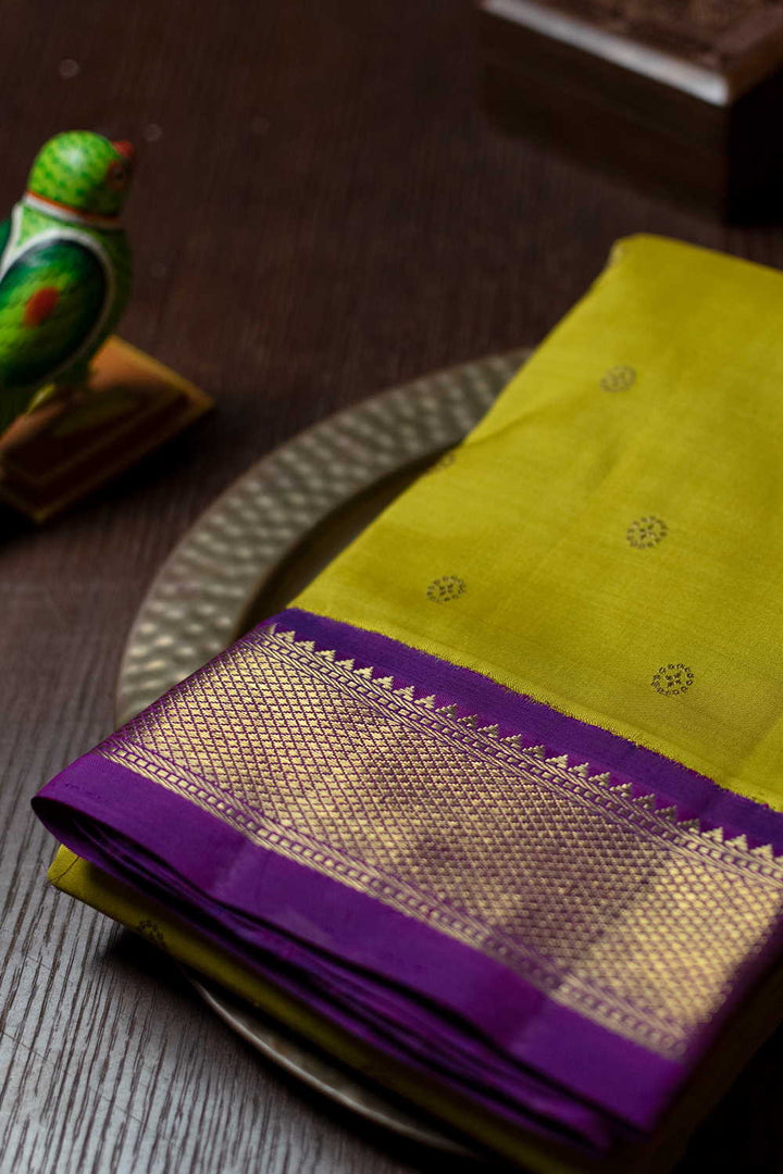 Butta on Yellow with Pink Border Kanchipuram Silk saree