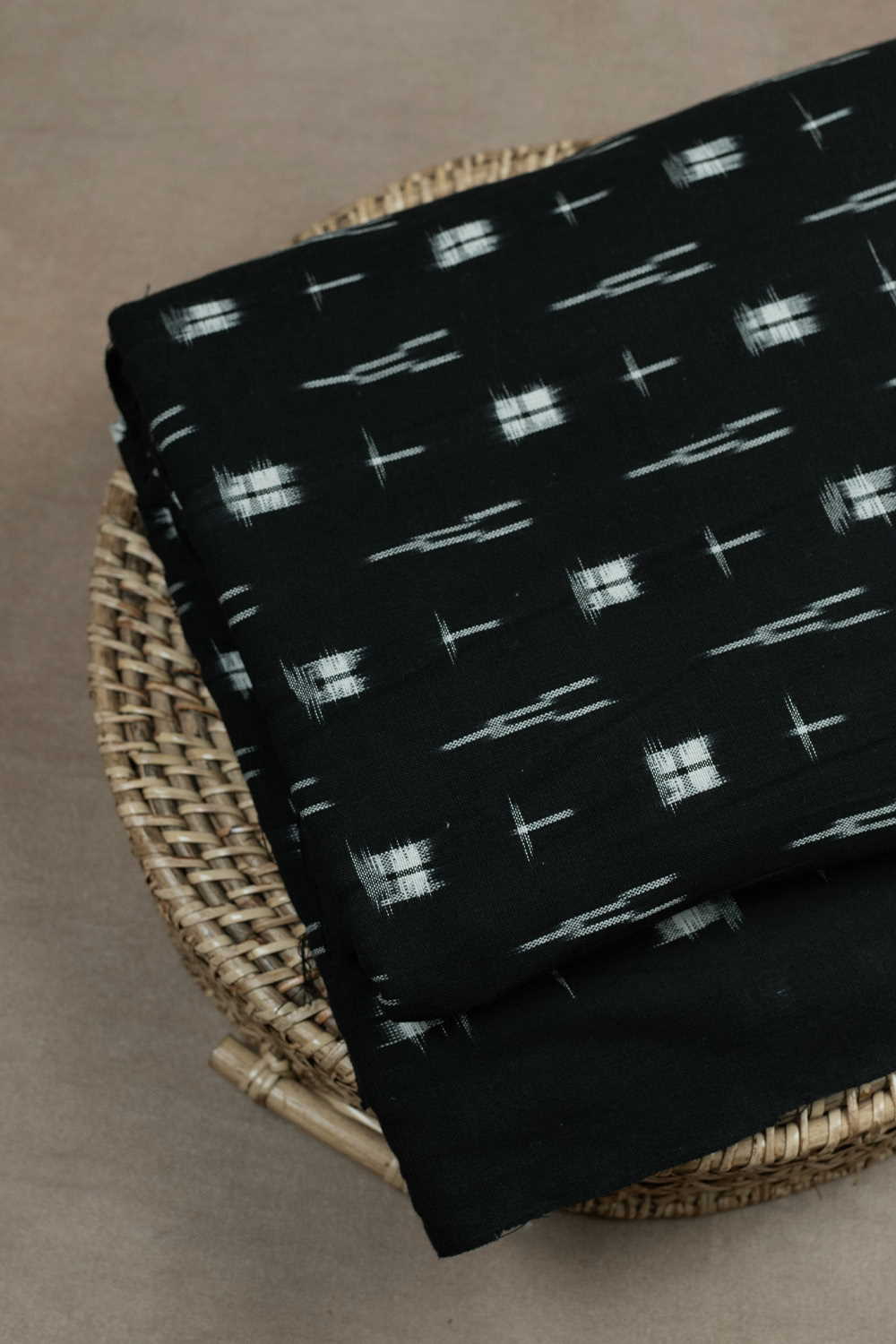 Cream Butta on Dark Black Ikat Cotton Fabric